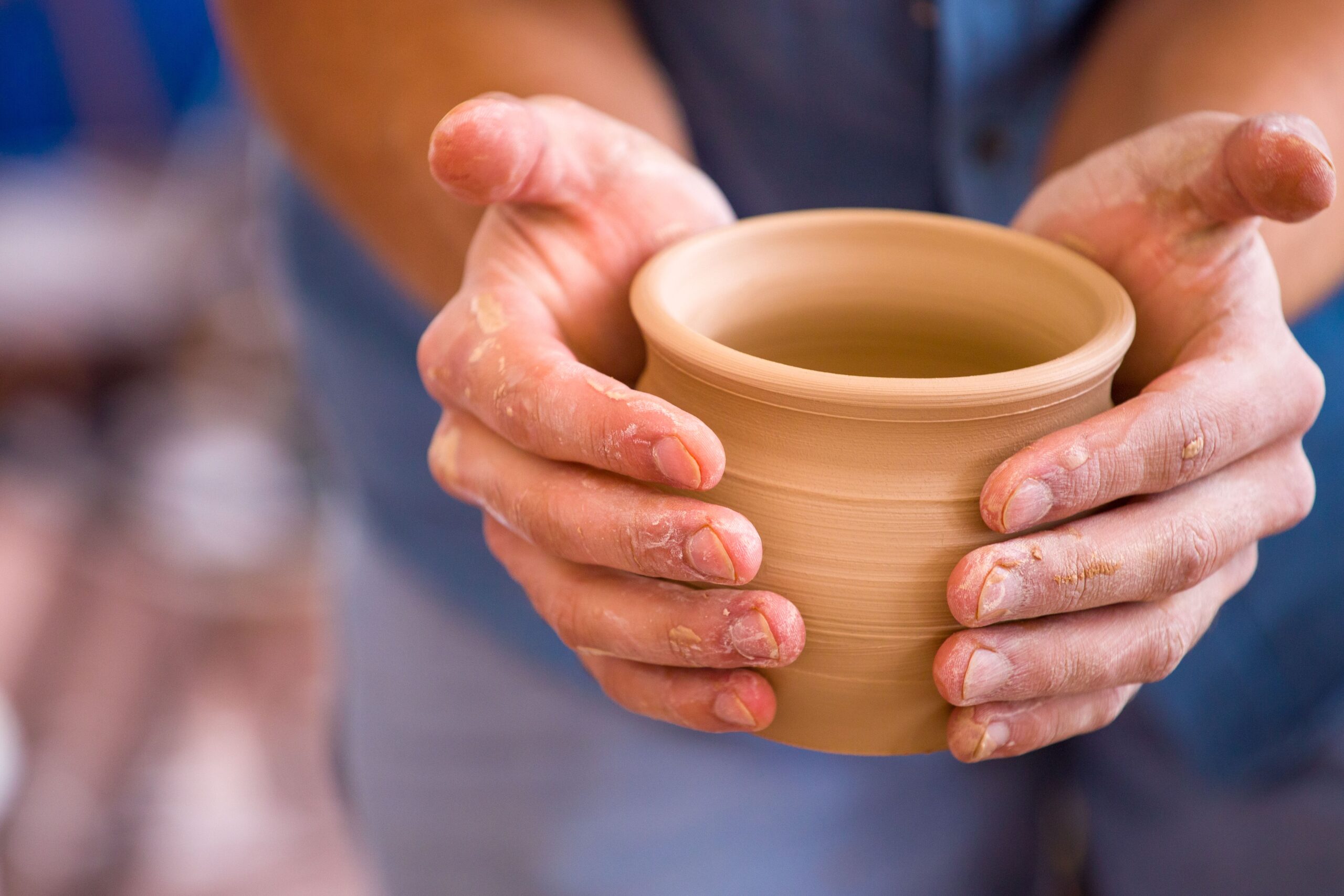 Close-up,Of,The,Potter's,Hands,Holding,A,Clay,Pot,He